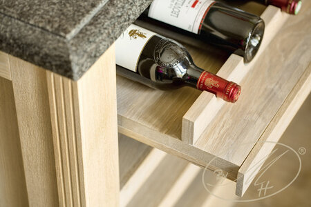 Material: oak veneer, solid oak, oil. Detail of the wine cellar.